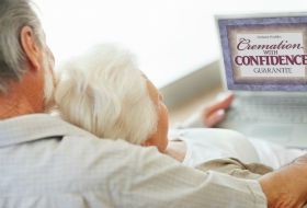 Older Couple Looking at Computer Screen and Link to Cremation Services 